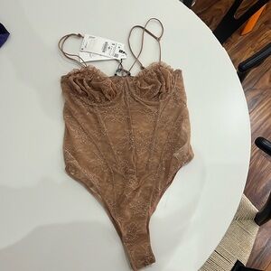 Nude lace body suit with boning